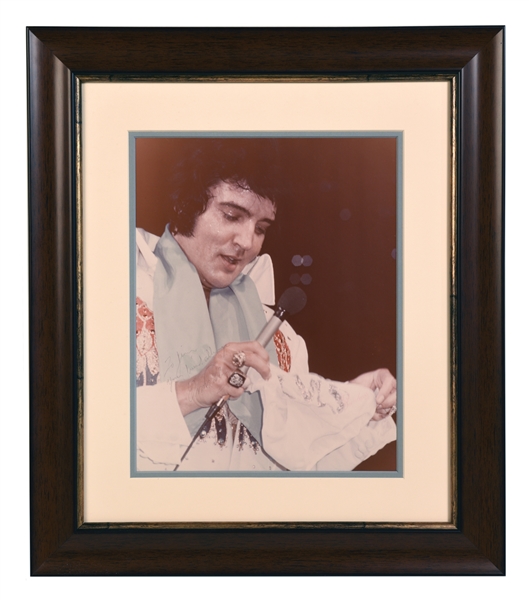 Impressive Elvis Presley Signed 11x14 Photo of Elvis in Concert Wearing One of His Blue Stage Scarves