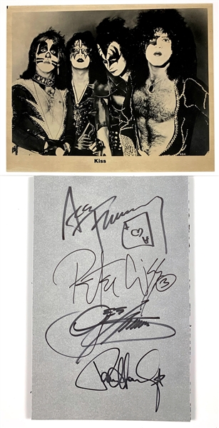 Sheet Perfectly Signed by all Four Members of KISS – Paul Stanely, Gene Simmons, Ace Frehley and Peter Criss with Vintage Publicity Photo