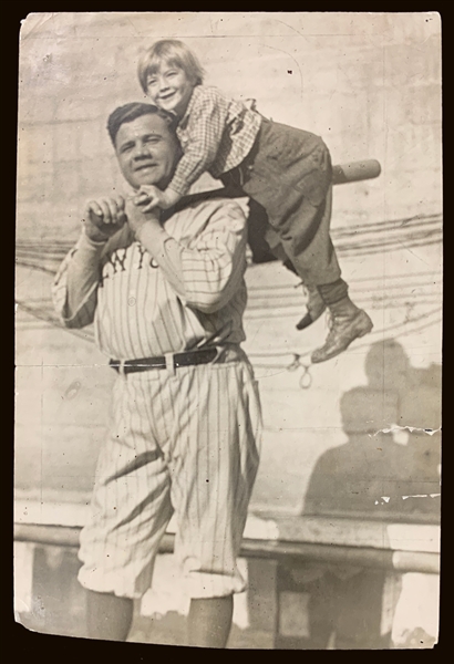 1924 Original News Service Photo of Babe Ruth on California Barnstorming Tour – Carrying Child Actor Jackie Coogan on his Bat! (Encapsulated PSA/DNA Type 3)