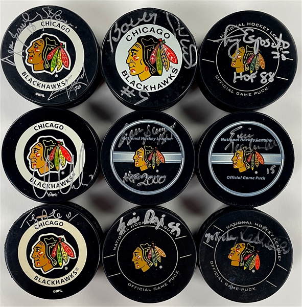 Chicago Blackhawks Signed Official NHL Game Puck Group of 16 Incl. Bobby Hull, Tony Esposito, Denis Savard and Others (BAS)
