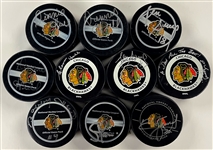 Chicago Blackhawk Signed Game Puck Group of 10 Incl. Bobby Hull and Others (with Duplicates) (BAS)