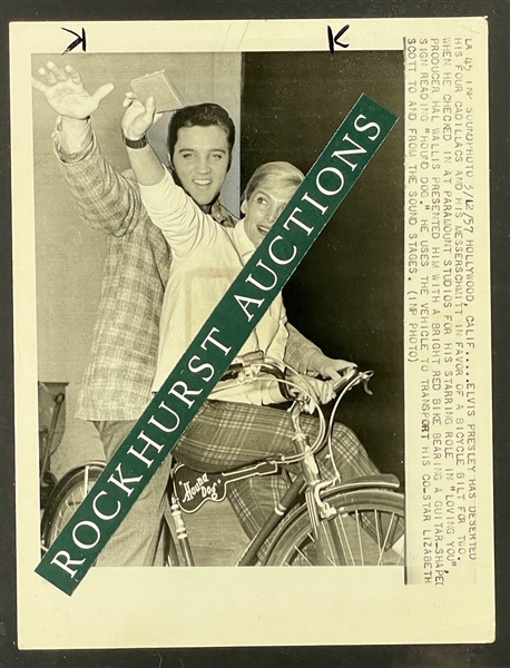 1957 Elvis Presley Riding a "Hound Dog" Bike on the Set of  <em>Loving You</em> with Co-Star Lizbeth Scott Original News Service Wire Photo