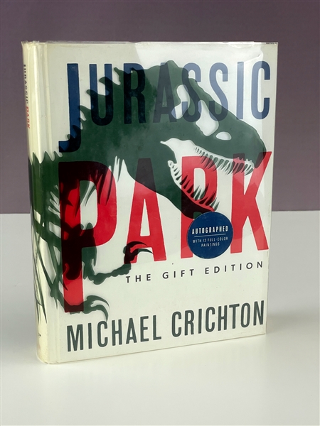 1993 Michael Crichton Signed Copy of <em>Jurassic Park</em> - Gift Edition with Acetate Cover (JSA)